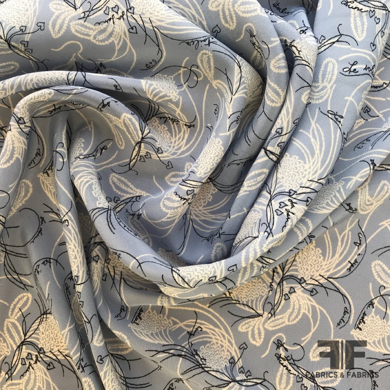 Abstract Floral Silk Georgette with French Text – Blue/White/Black Fabric by the Yard